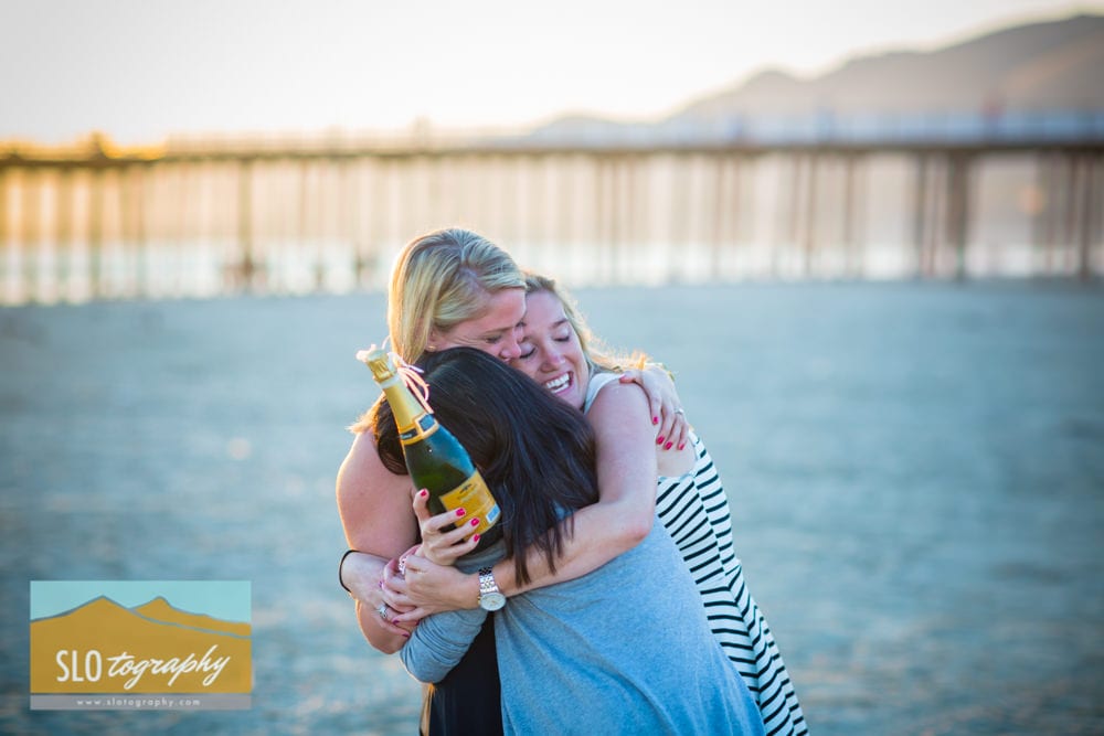 Hugs and Champagne on the Beach
