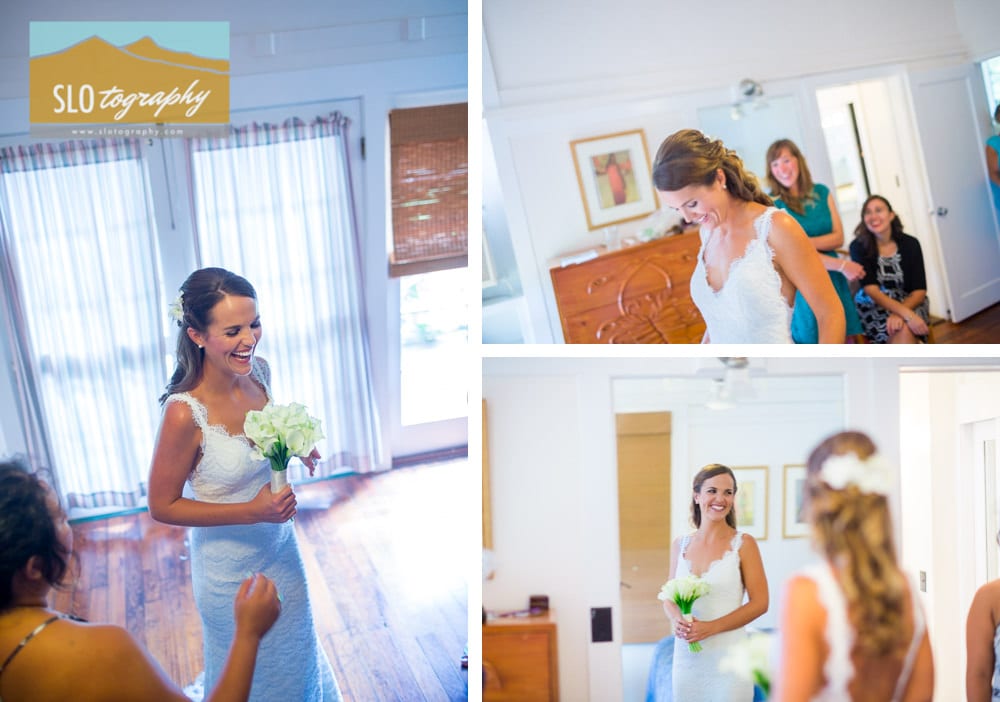 bride shows off her wedding gown to friends