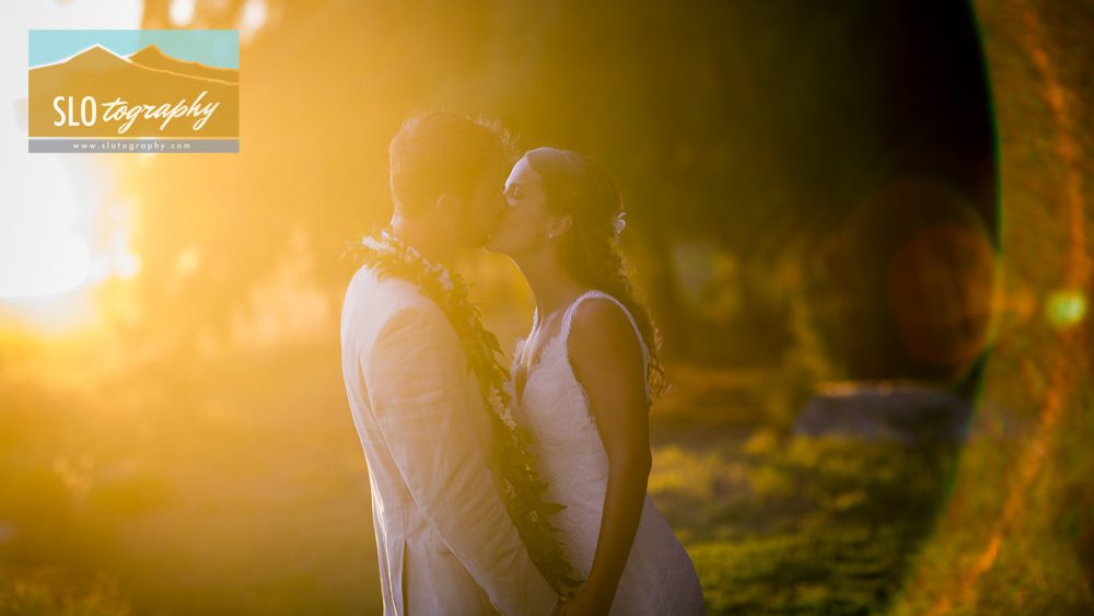 sunburst wedding couple kisses kauai