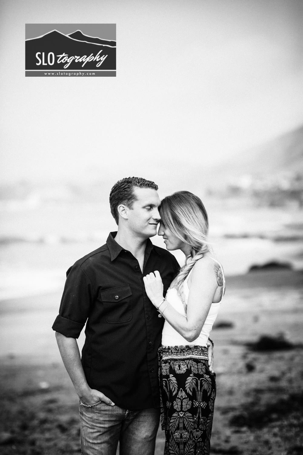 sweet couple black and white portrait in shell beach