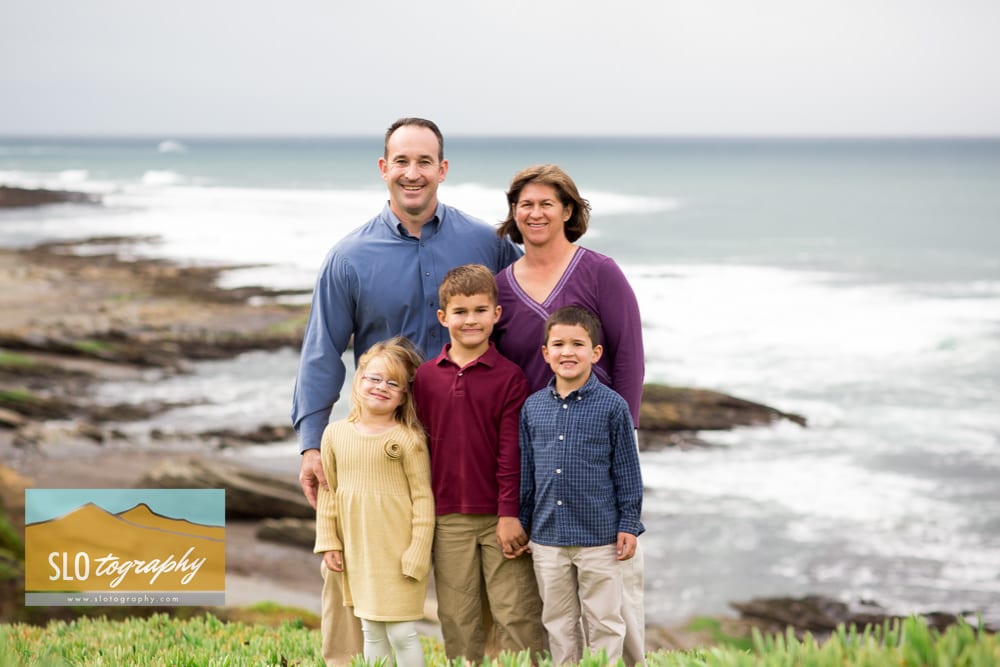 family portrait on the cliff with pacific ocean backdrop