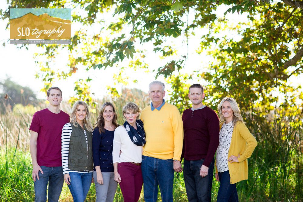 the grown kids portrait with parents in mustard and maroon