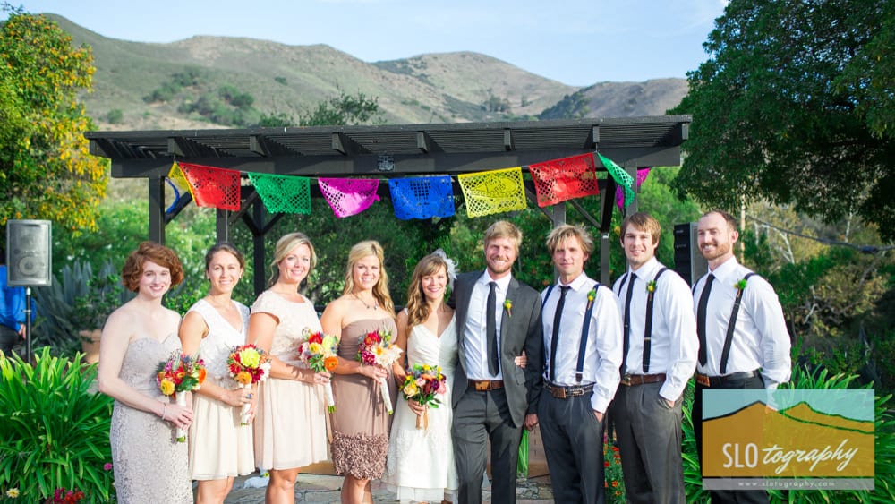 the wedding party portrait with hills in the background