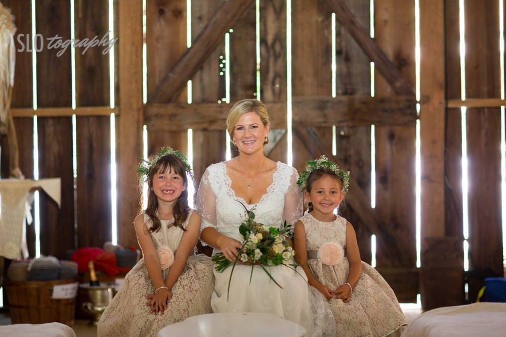 Bride with Flower Girls in Barn
