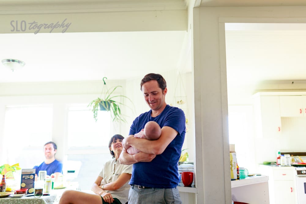 Father Holds Baby in Bright Kitchen