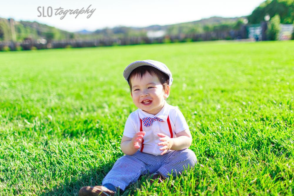 Kid Suited for Wedding in the Grass