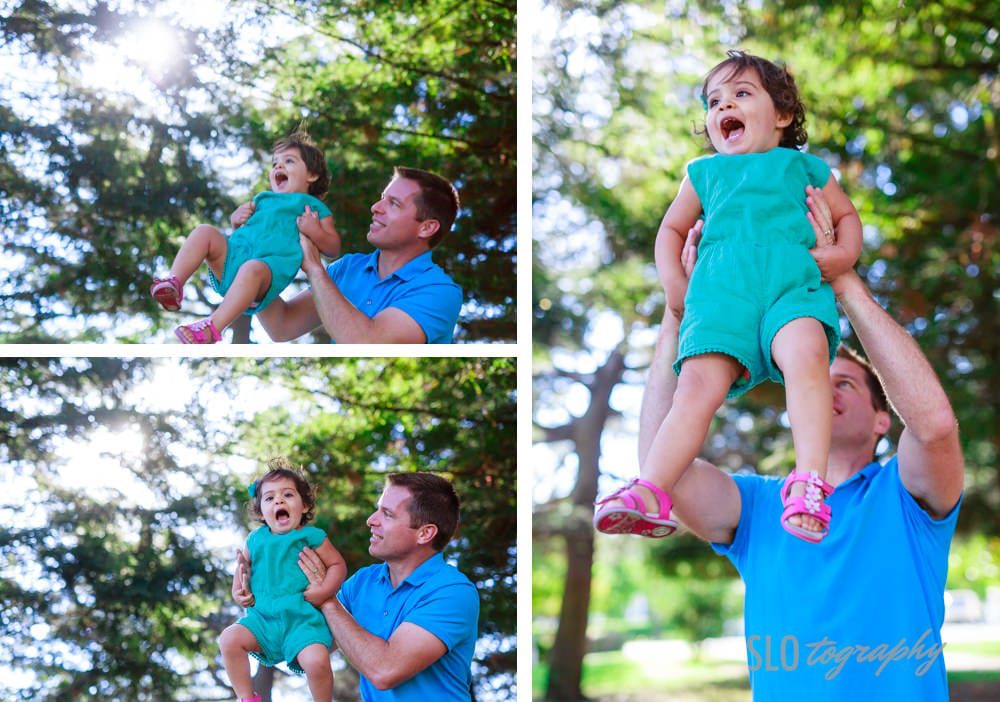Little Girl Held High by Dad
