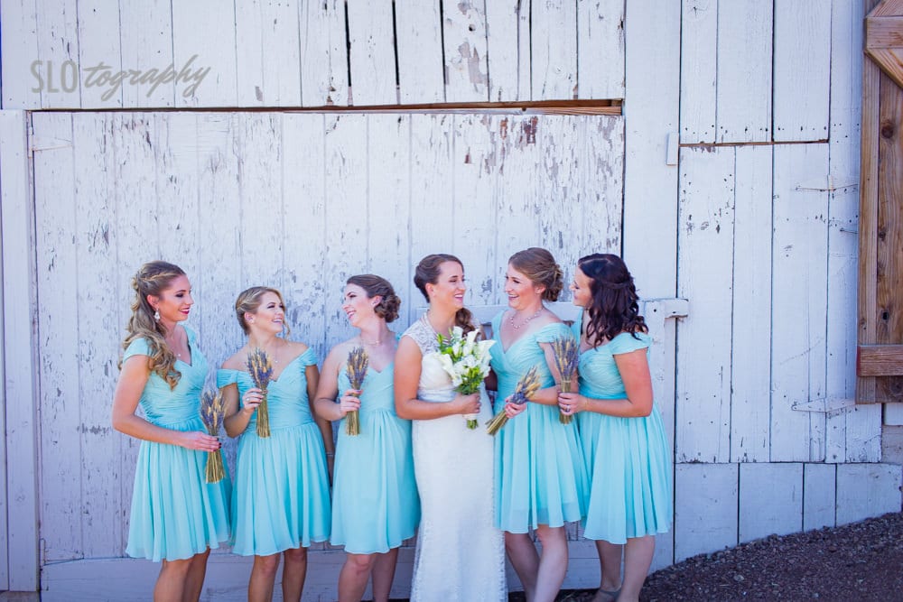 Bridesmaids in front of barn
